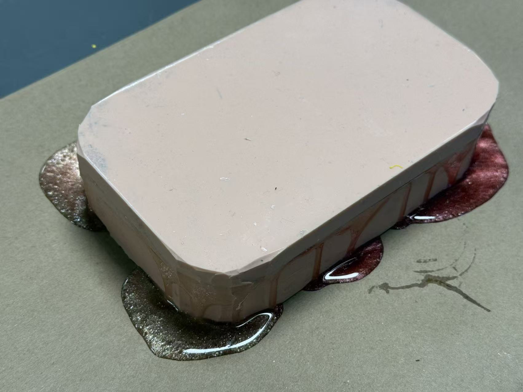 Two resin colors poured into the phone case mold
