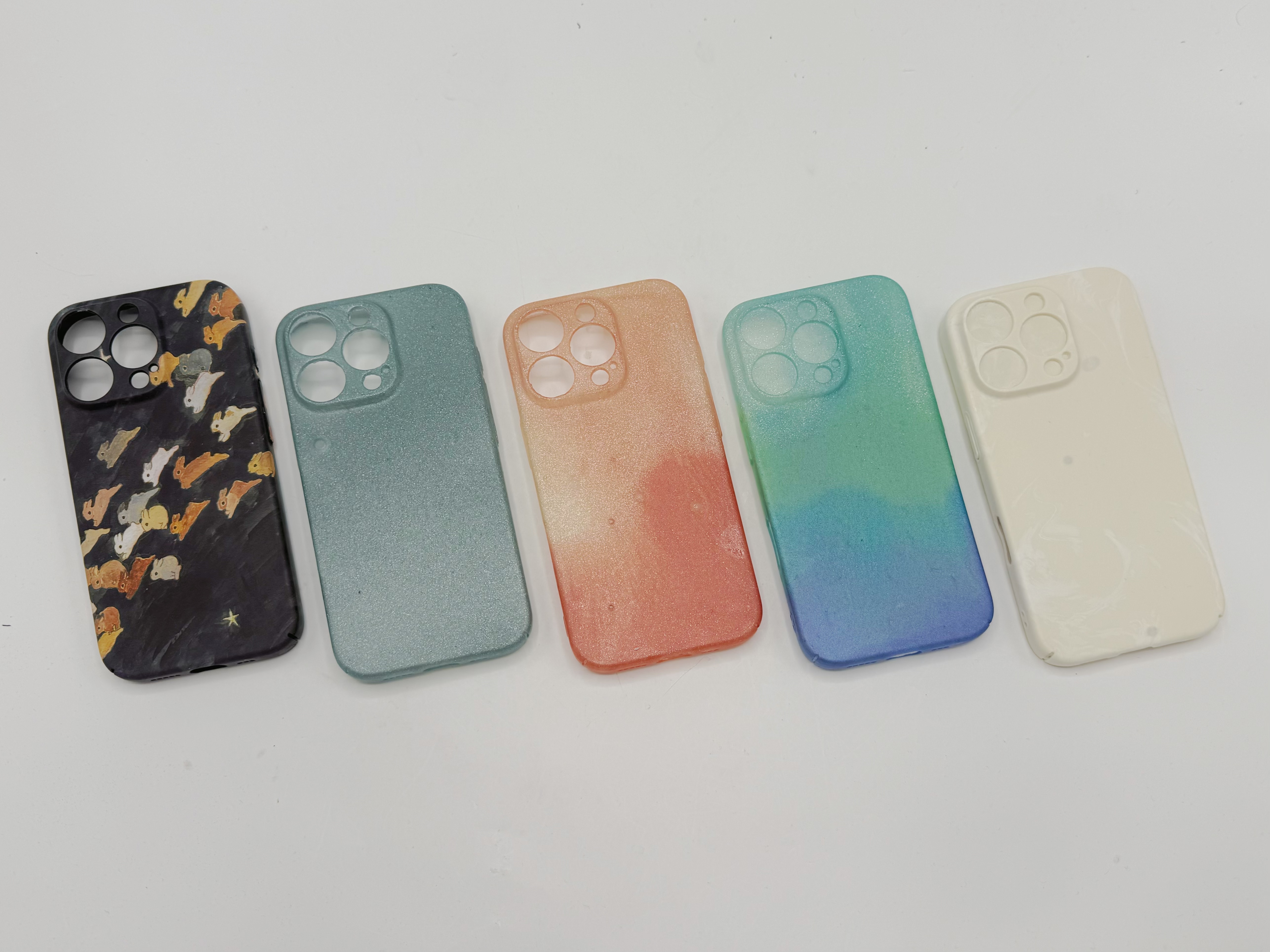 All four phone case resin casts together
