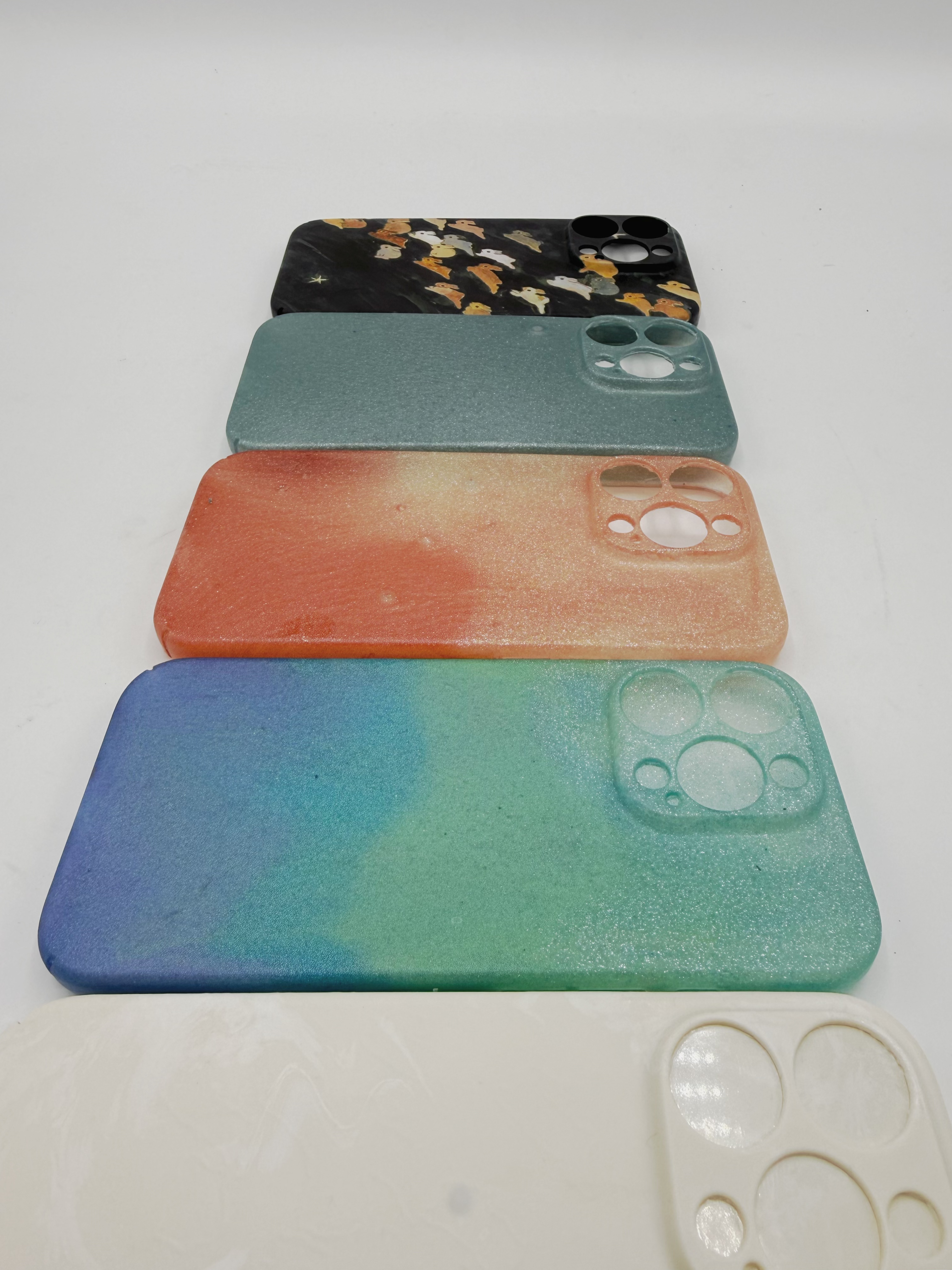 Close-up of all four phone case casts