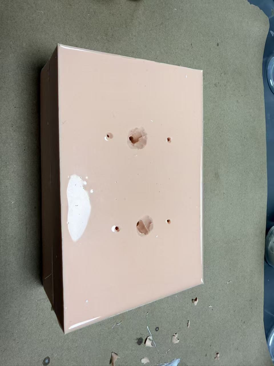Carving funnel-shaped guide channels into the silicone
