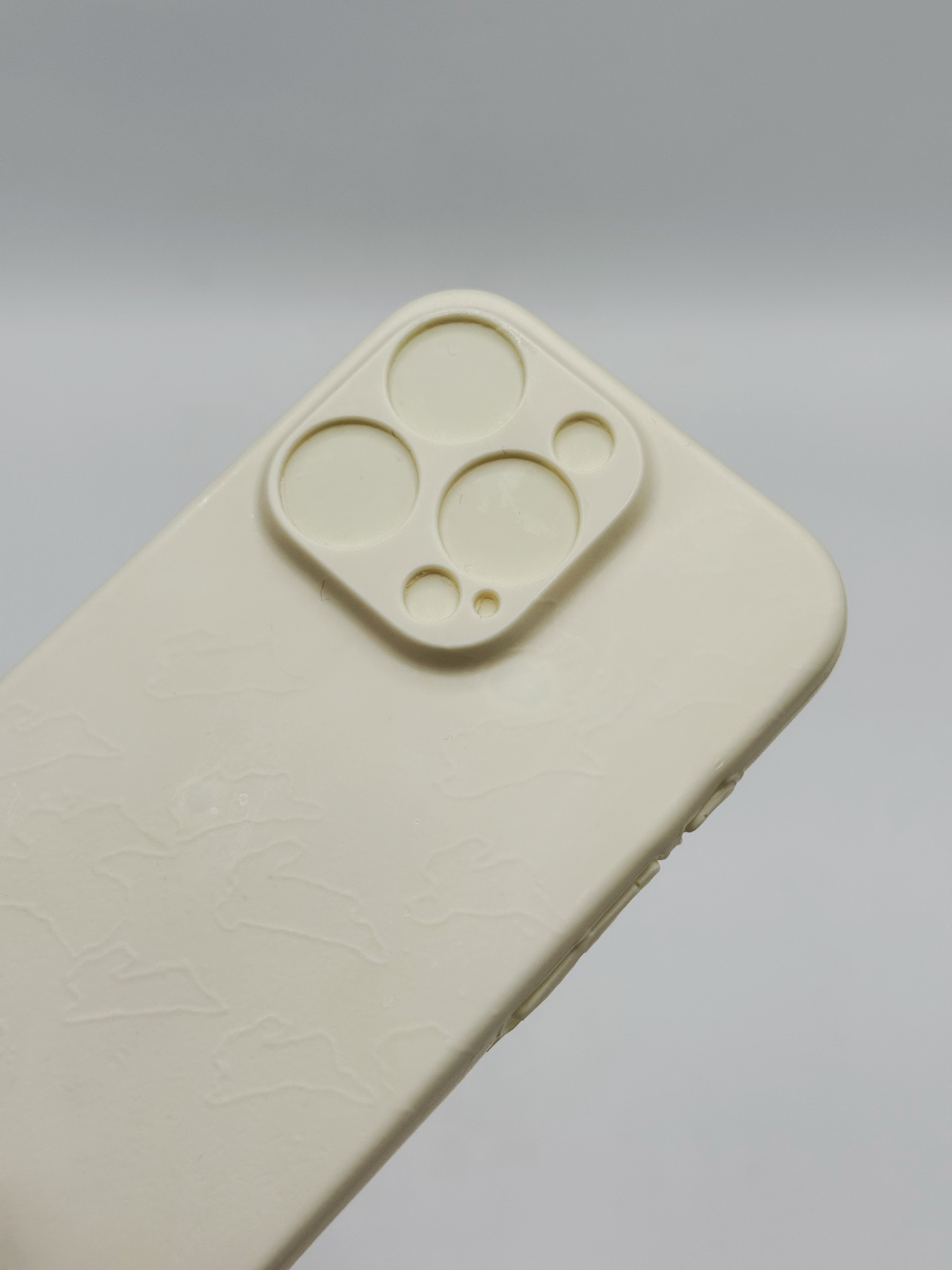 White polyurethane phone case cast from leftover resin