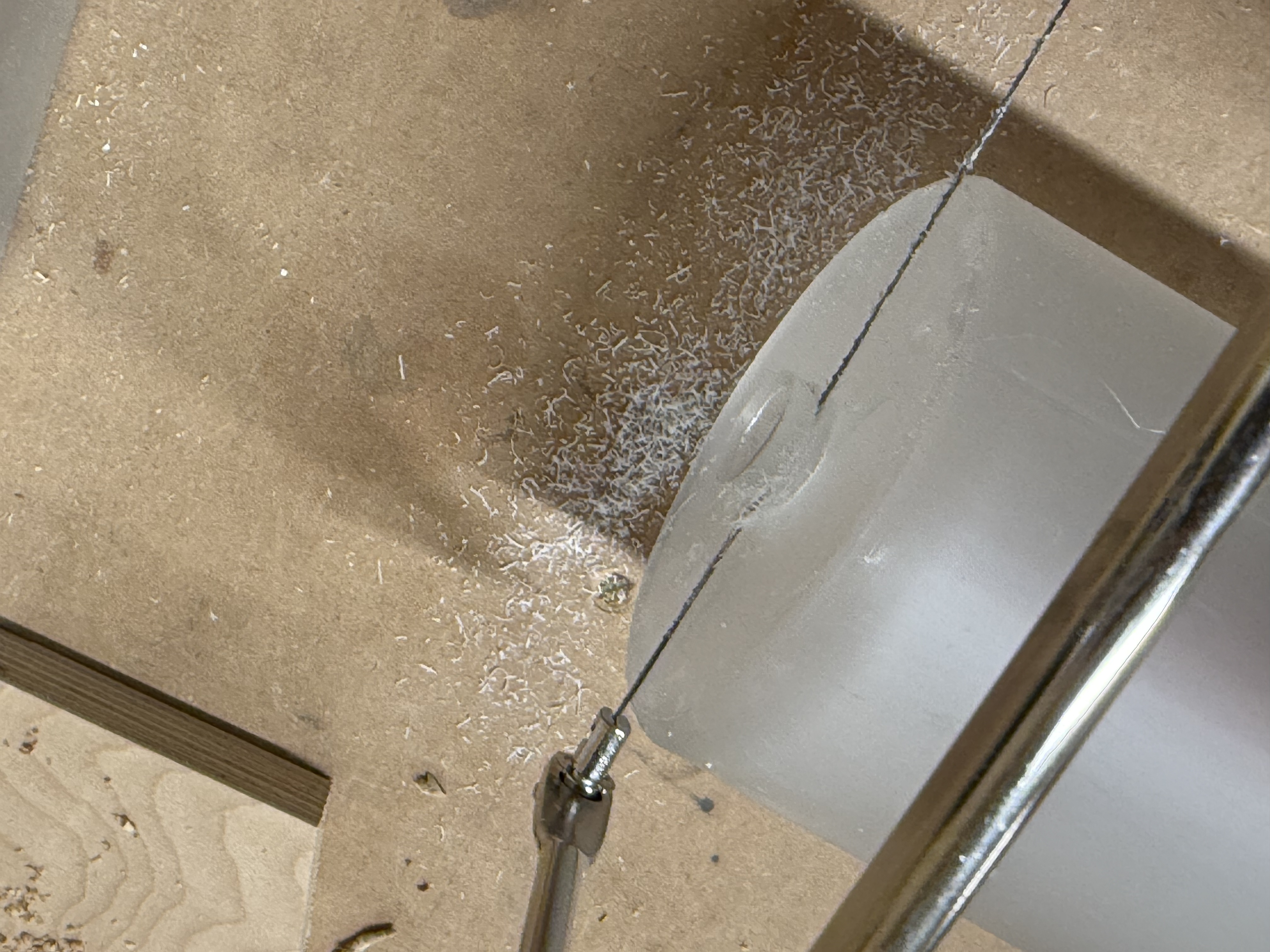 Trimming the resin lid with a band saw