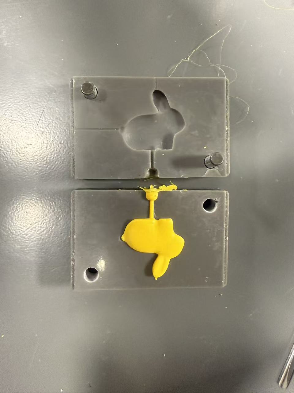 Opened mold revealing the injection-molded rabbit