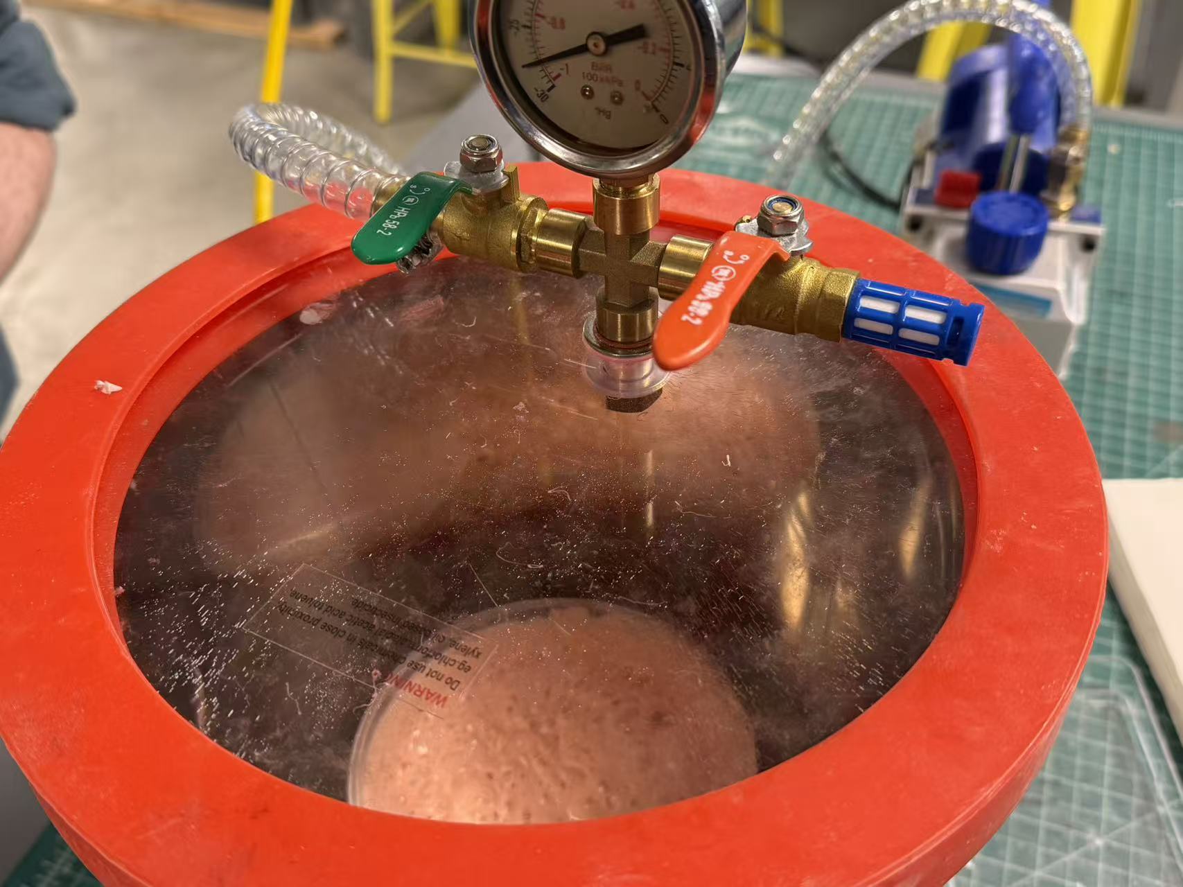 Degassing silicone in vacuum chamber